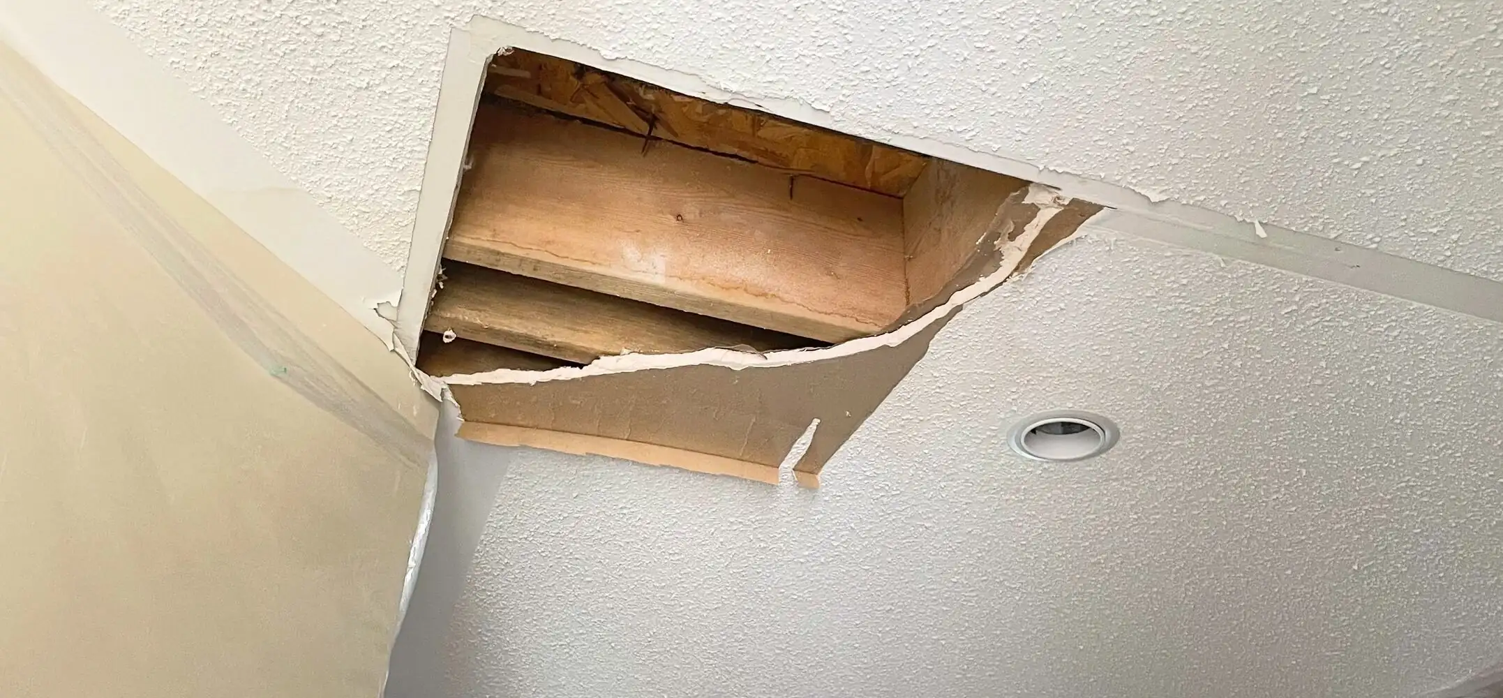 Before: Living Room Ceiling Leak & Popcorn Texture Repair damage