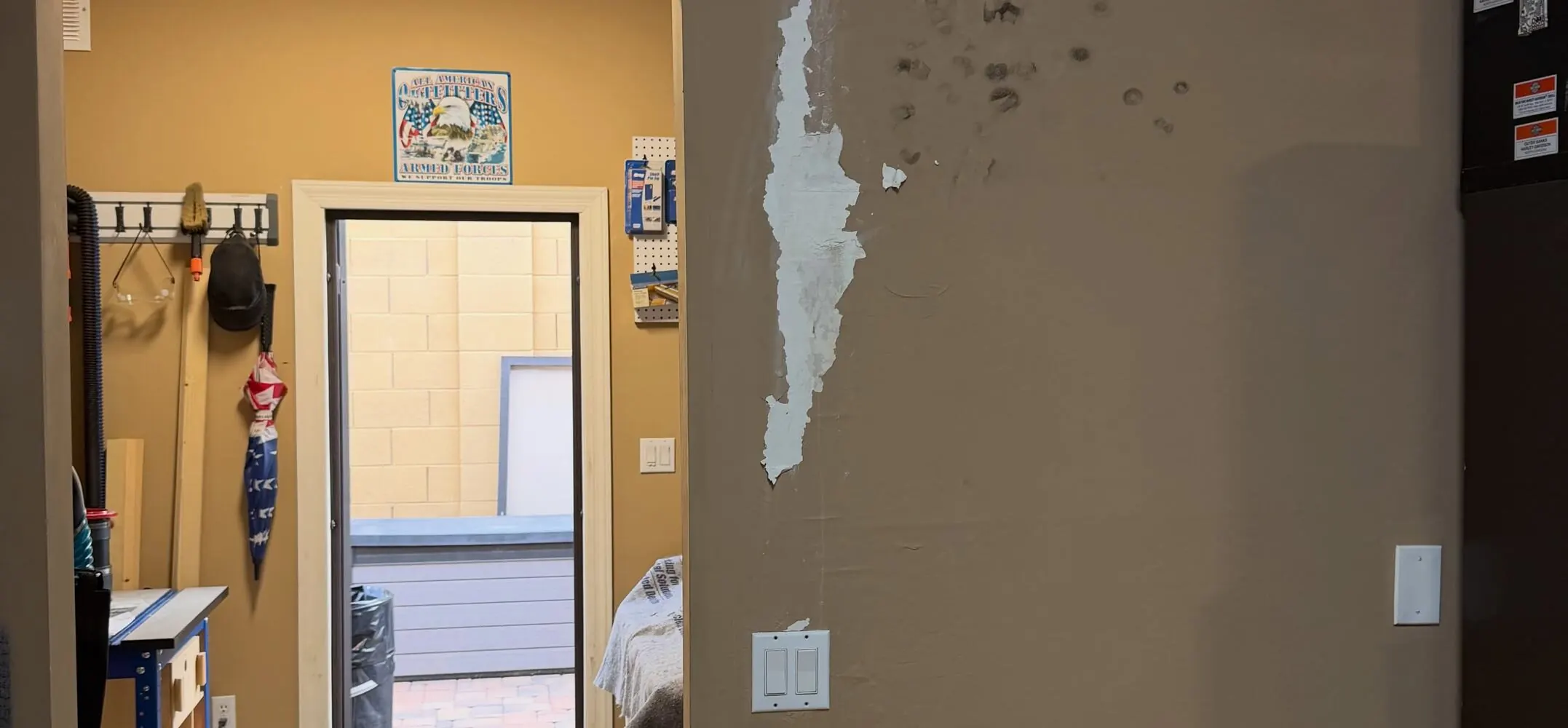 Before: Water-Damaged Wall Rebuild — Retail Back Office damage