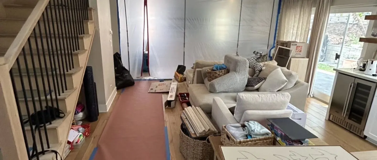 Living room protected with floor runners during water damage restoration